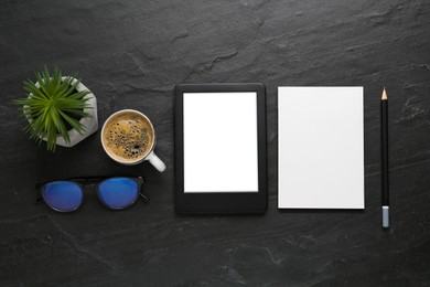 Photo of Flat lay composition with modern e-book reader on black table