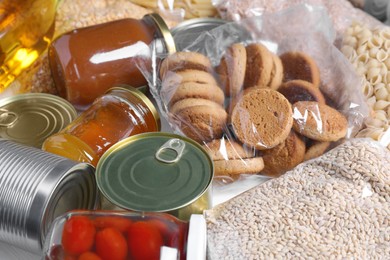 Photo of Different products on table, closeup. Food donation