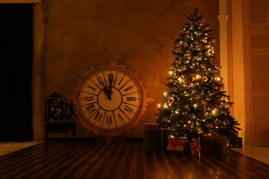 Festive room interior with beautiful Christmas tree