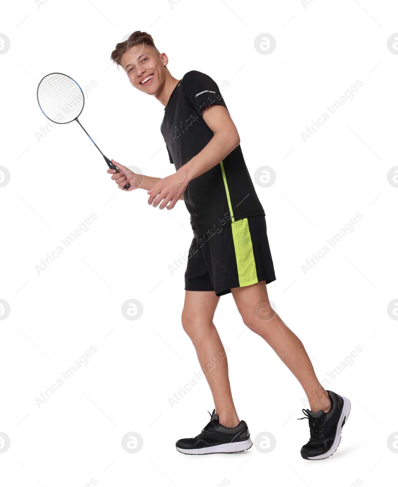 Photo of Young man playing badminton with racket on white background