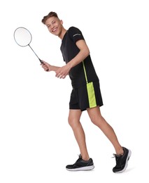 Young man playing badminton with racket on white background