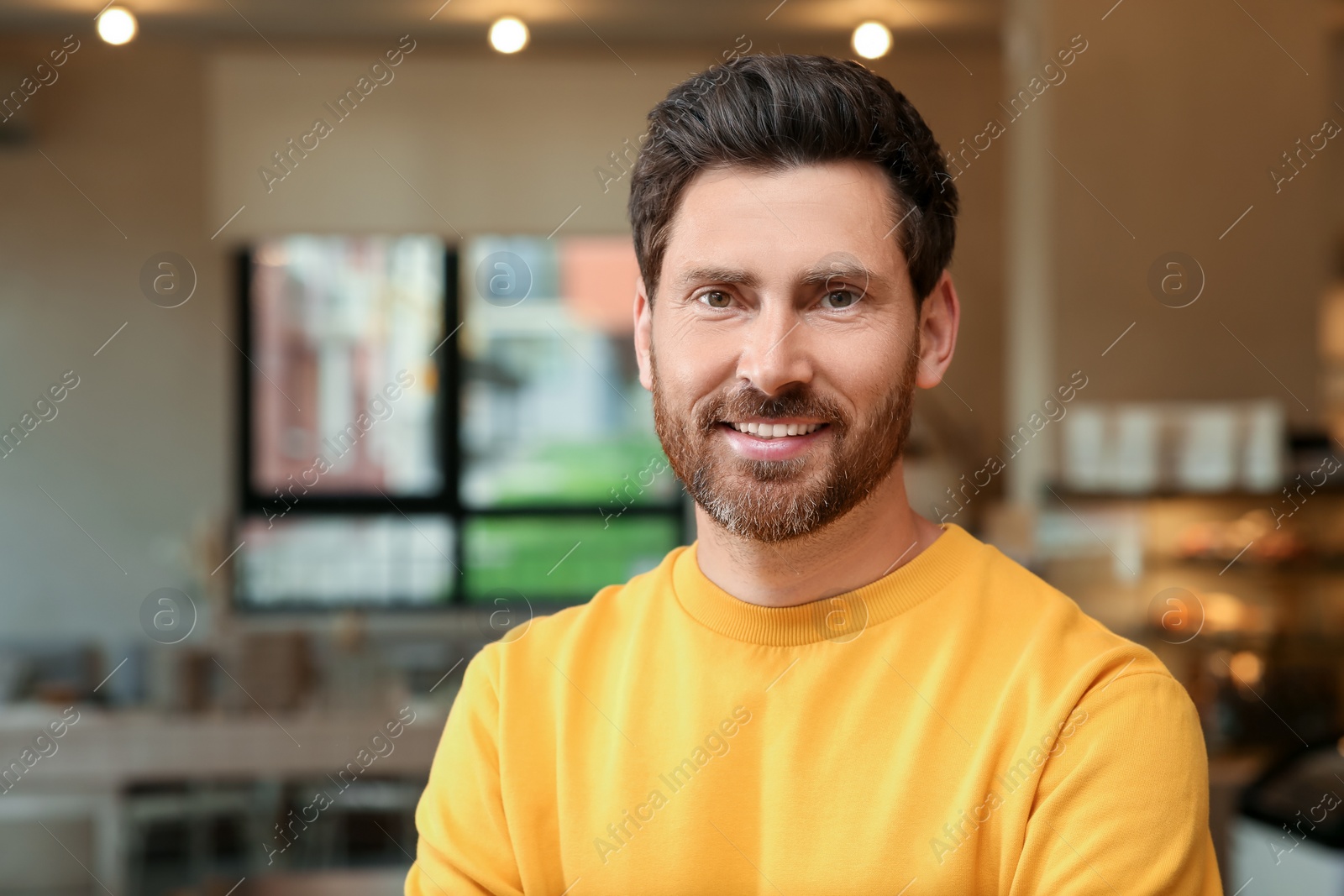 Photo of Portrait of handsome stylish man in office