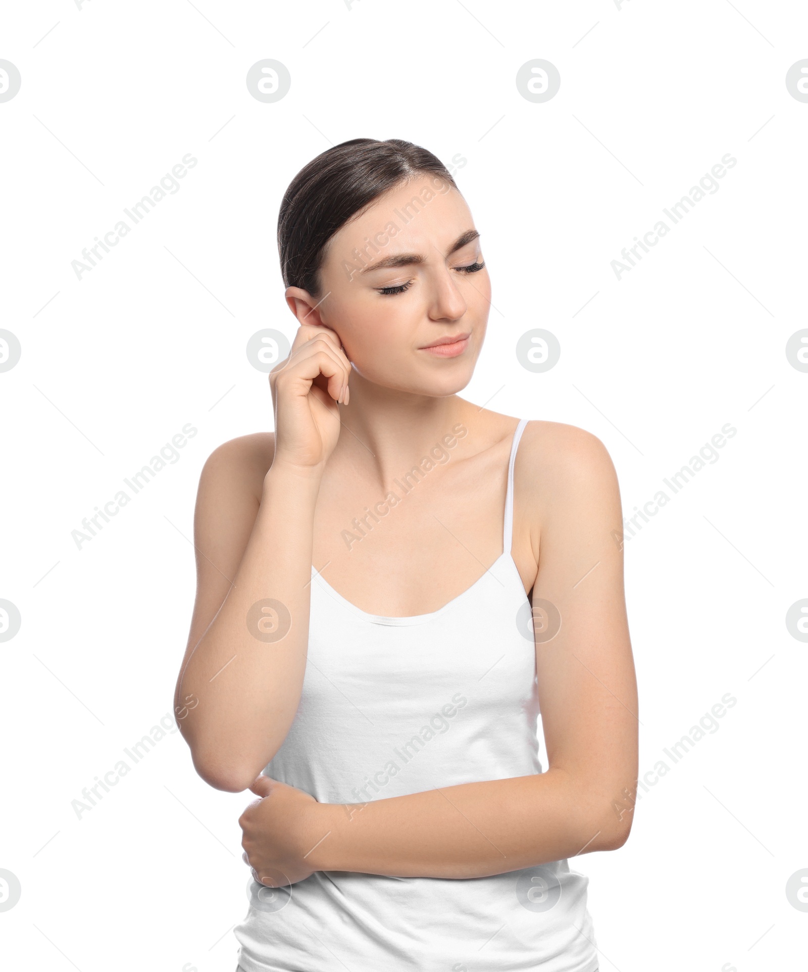 Photo of Young woman suffering from ear pain on white background