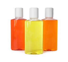 Photo of Three bottles of mouthwash isolated on white