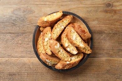 Traditional Italian almond biscuits (Cantucci) on wooden table, top view