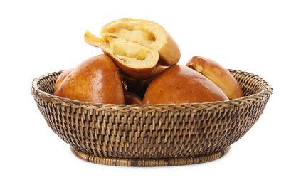 Photo of Delicious baked apple pirozhki in wicker basket on white background