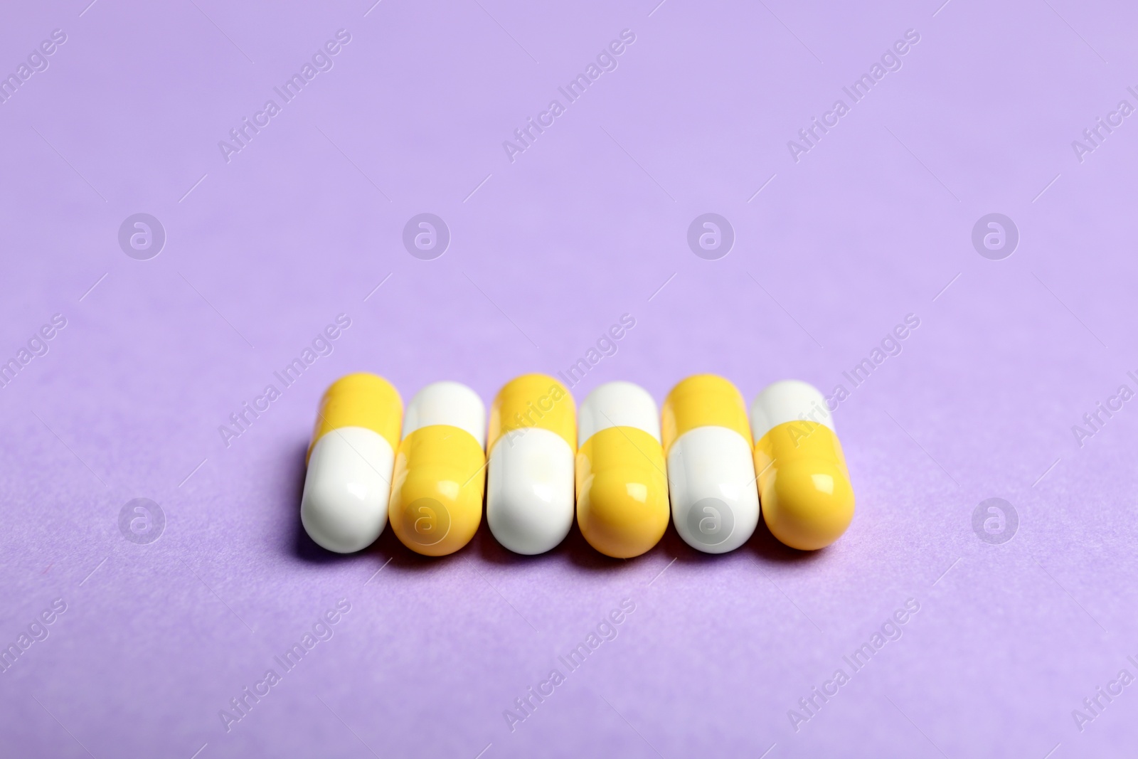 Photo of Pills on color background. Medical treatment