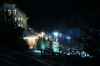 Photo of Beautiful view of village covered with snow at night