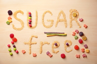 Photo of Composition with phrase SUGAR FREE on wooden background