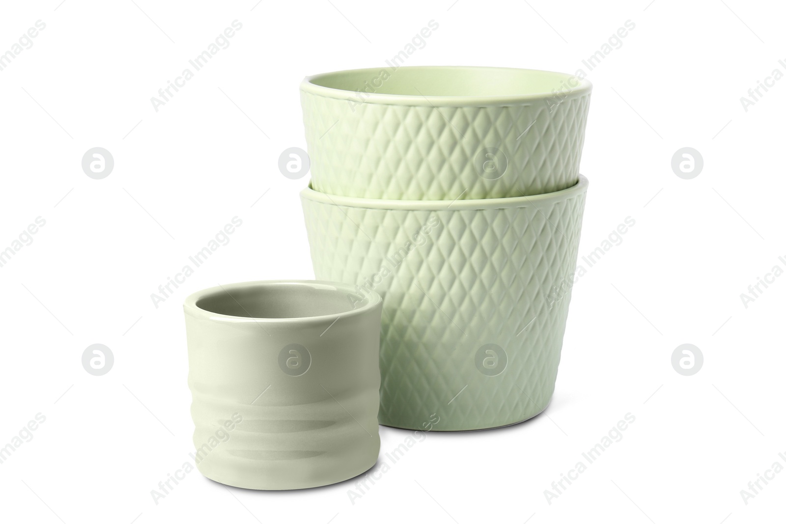 Photo of Different empty ceramic flower pots on white background