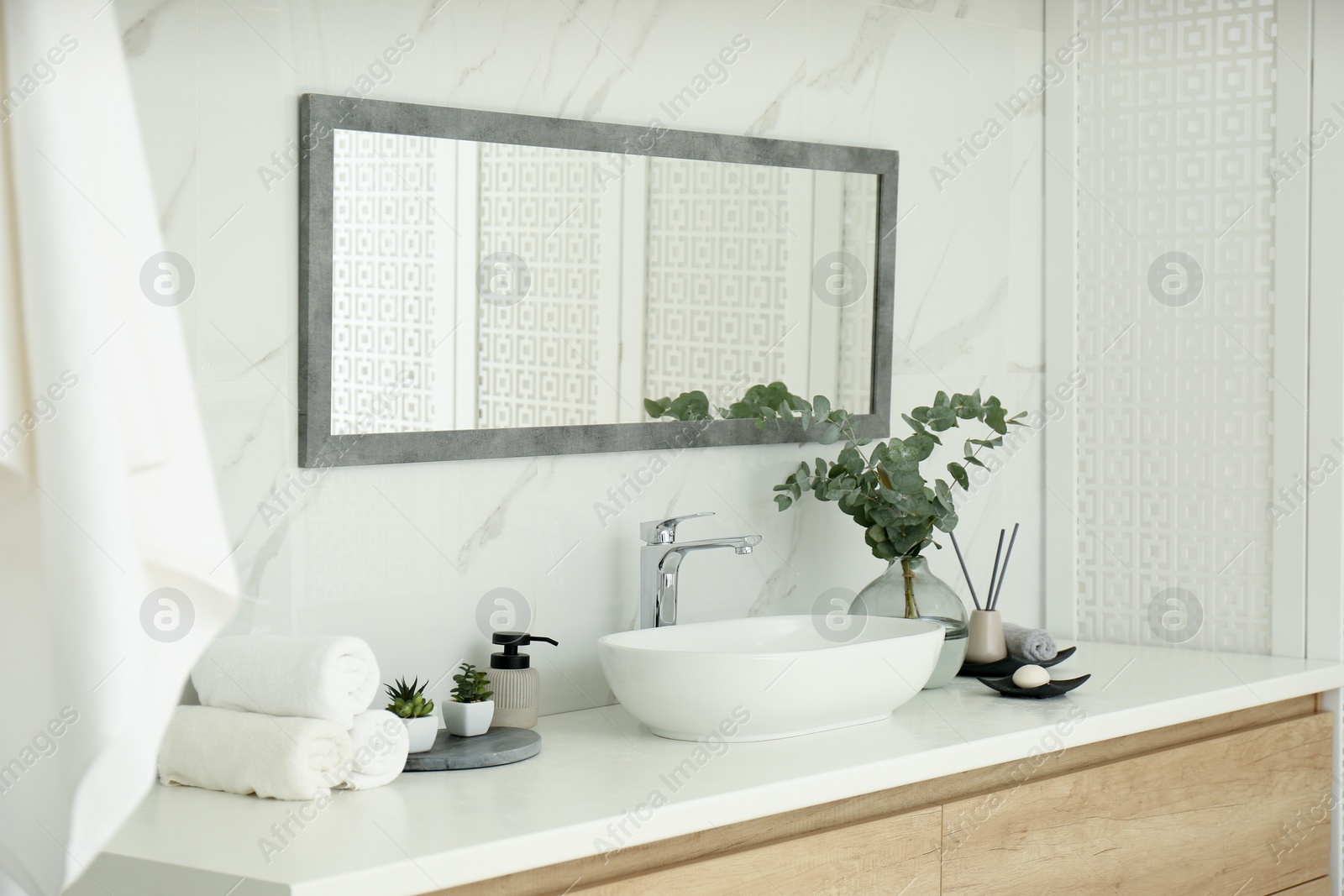 Photo of Modern bathroom interior with stylish mirror and vessel sink