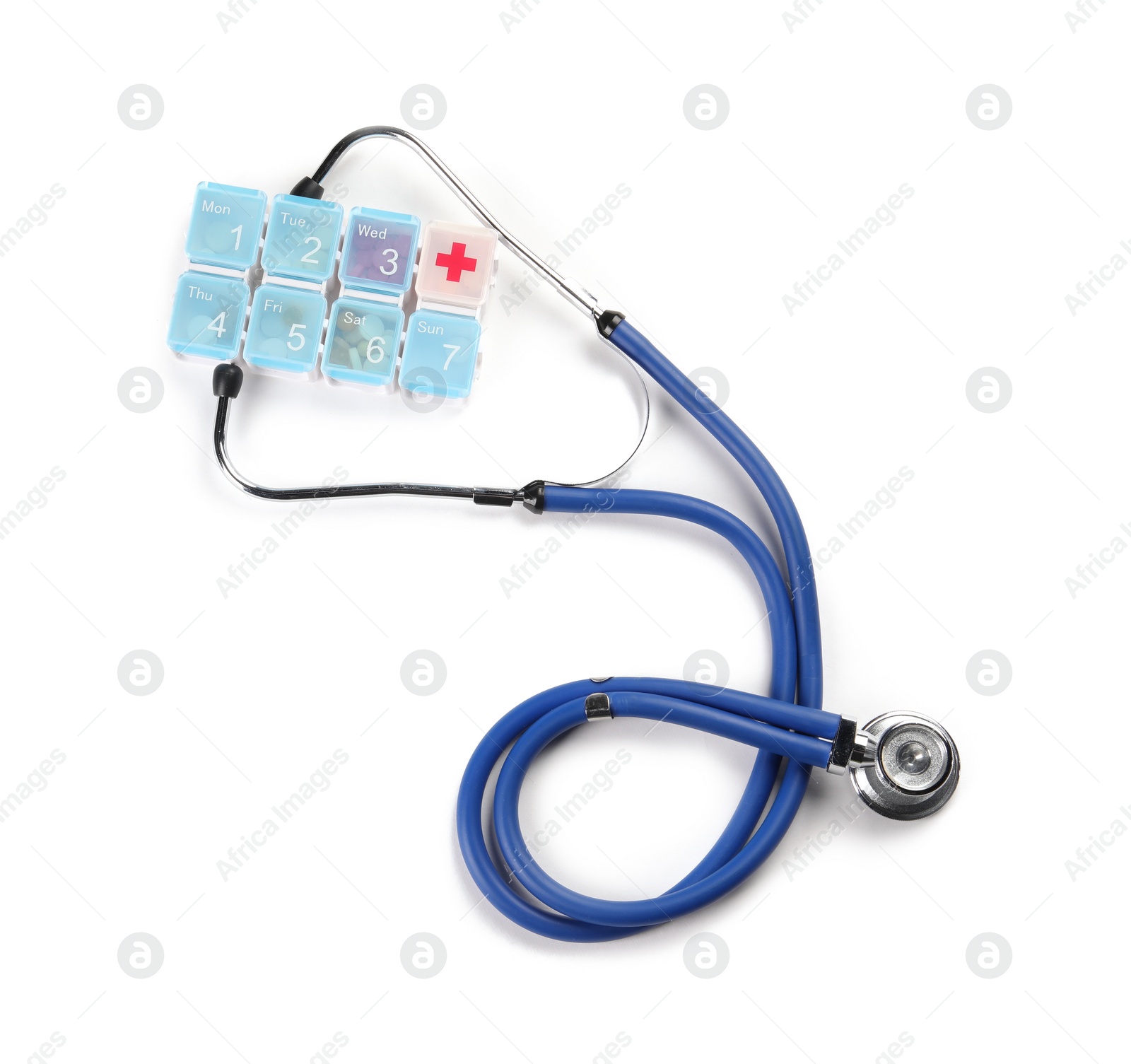 Photo of Stethoscope and plastic pill box on white background, top view