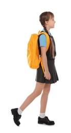 Photo of Full length portrait of cute girl in school uniform with backpack on white background