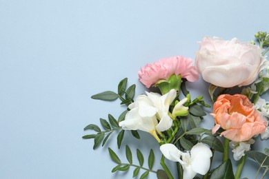 Different beautiful flowers on light background, flat lay. Space for text