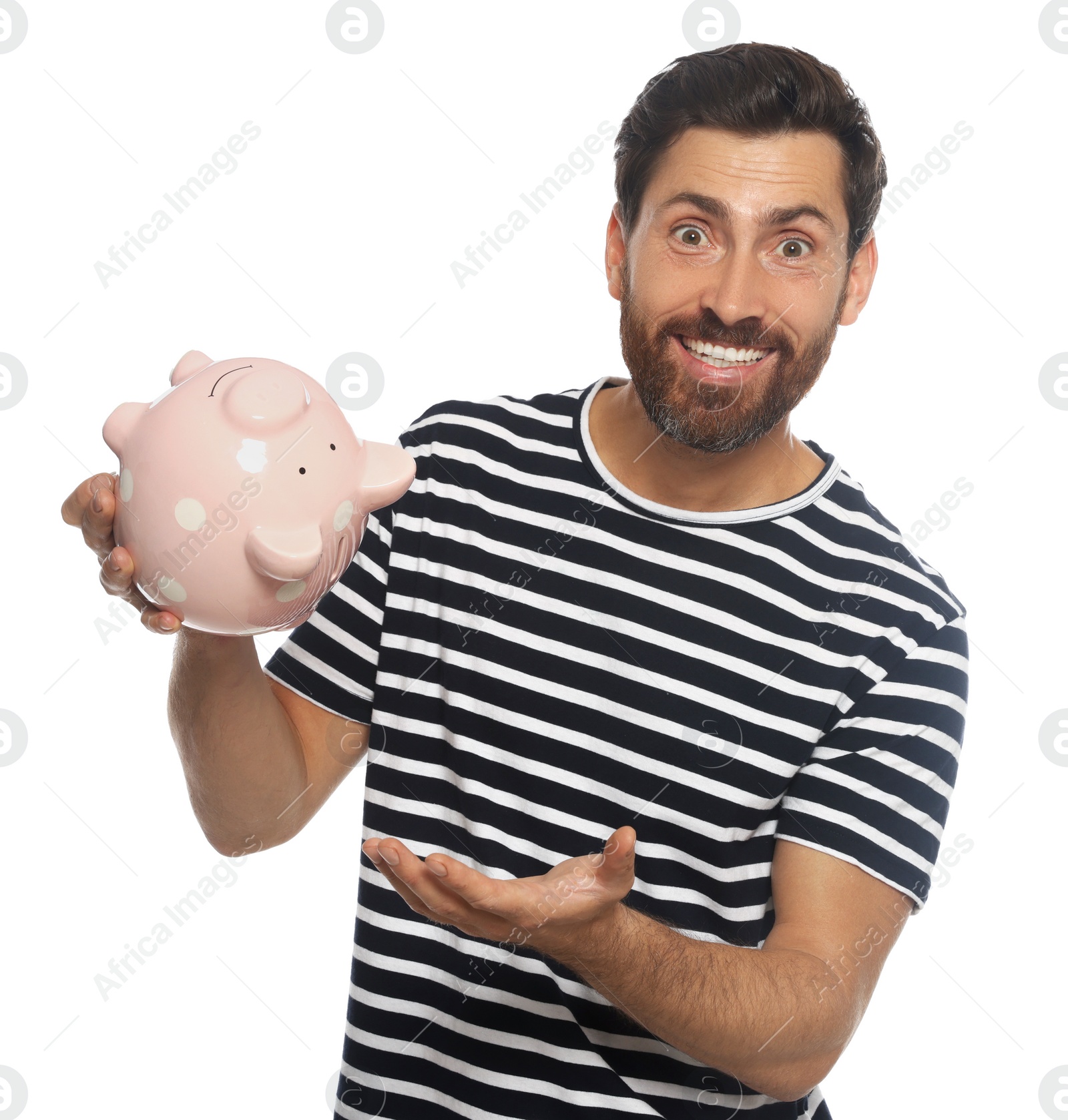 Photo of Happy man with ceramic piggy bank on white background