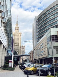 Different modern cars parked on city street