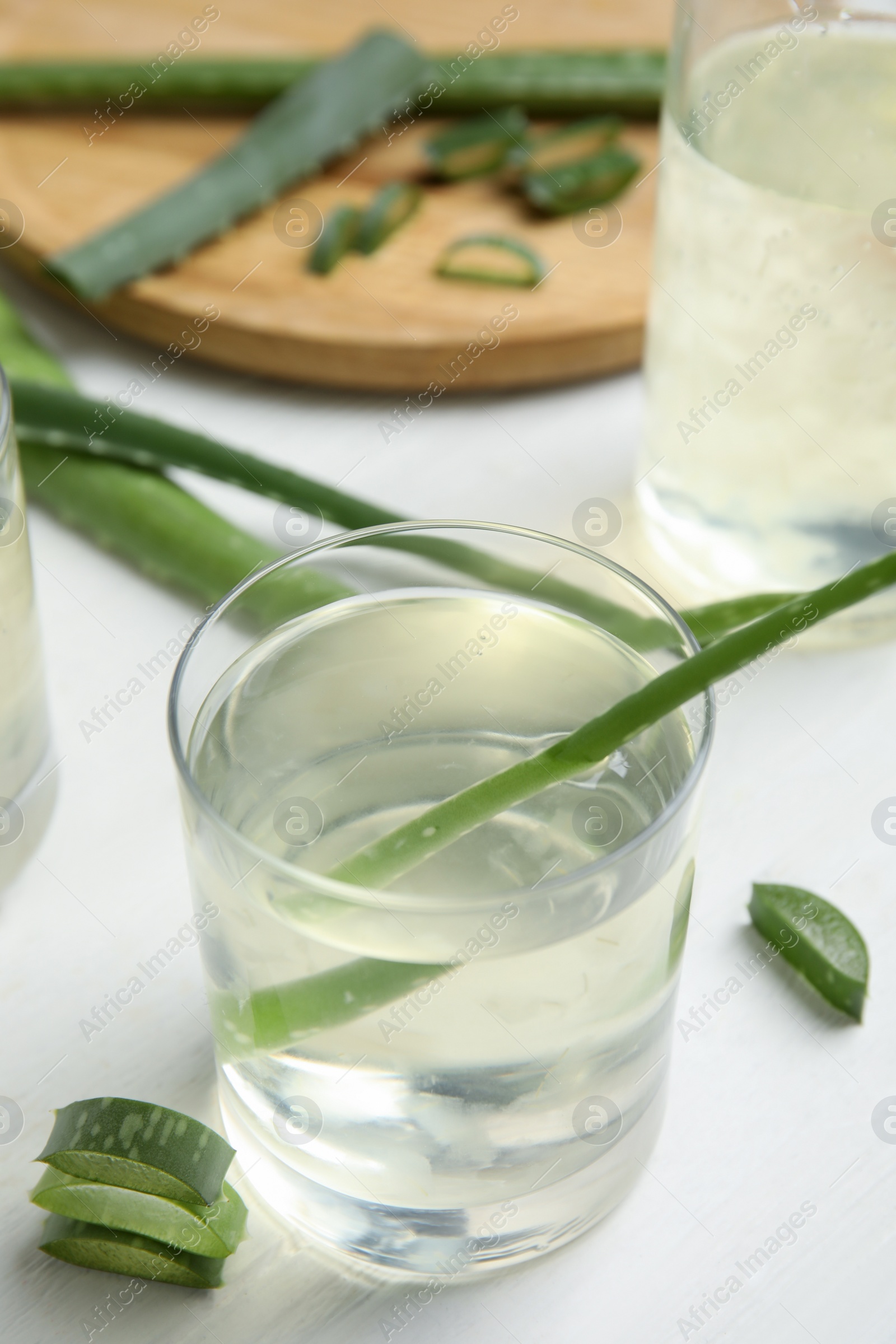 Photo of Fresh aloe drink on light wooden table