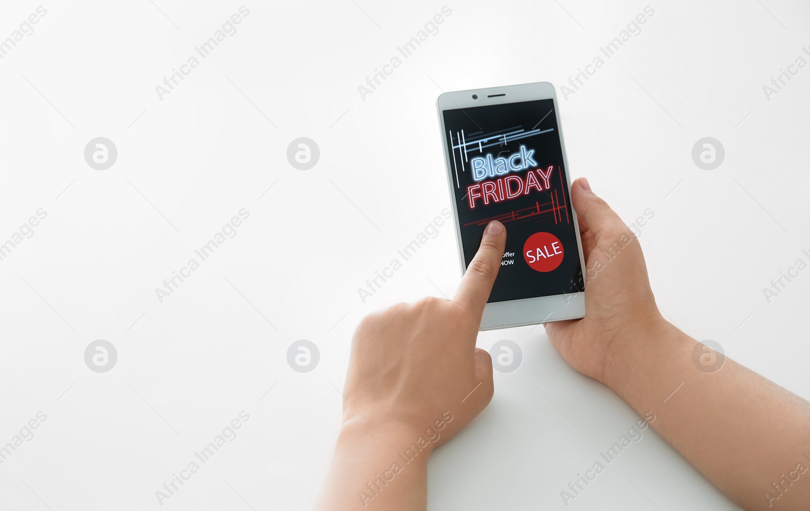 Photo of Woman shopping online using smartphone at table, closeup. Black Friday Sale