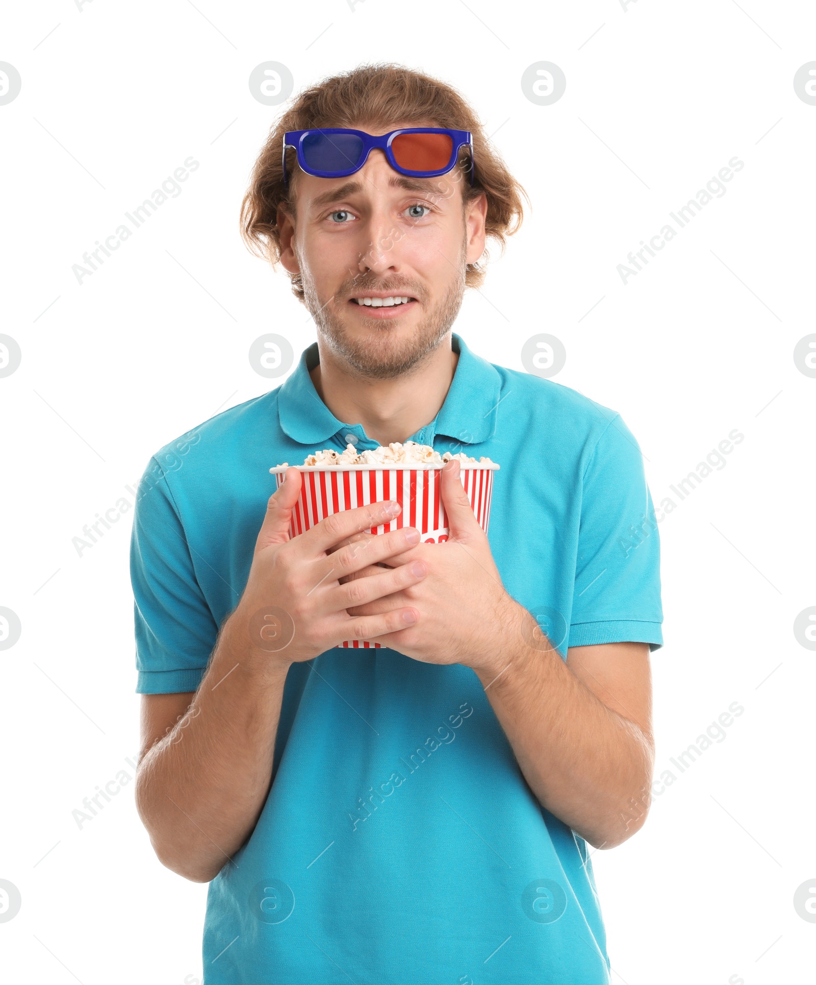 Photo of Emotional man with 3D glasses and popcorn during cinema show on white background