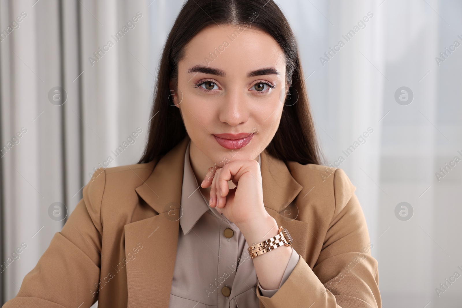 Photo of Beautiful young woman having online video call at home, view from camera