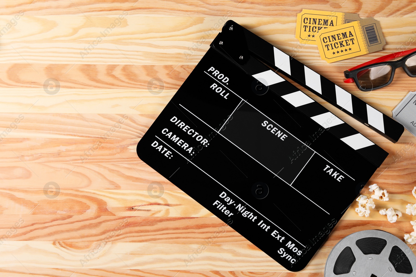 Photo of Flat lay composition with clapperboard and 3D glasses on wooden table, space for text