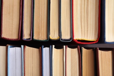 Many different hardcover books as background, top view