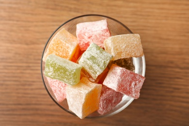 Photo of Turkish delight dessert on wooden table, top view