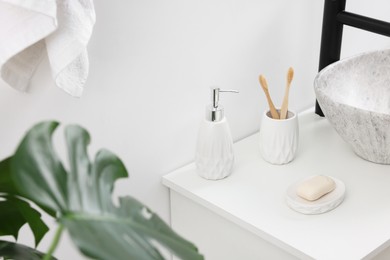 Photo of Different bath accessories and personal care products in bathroom