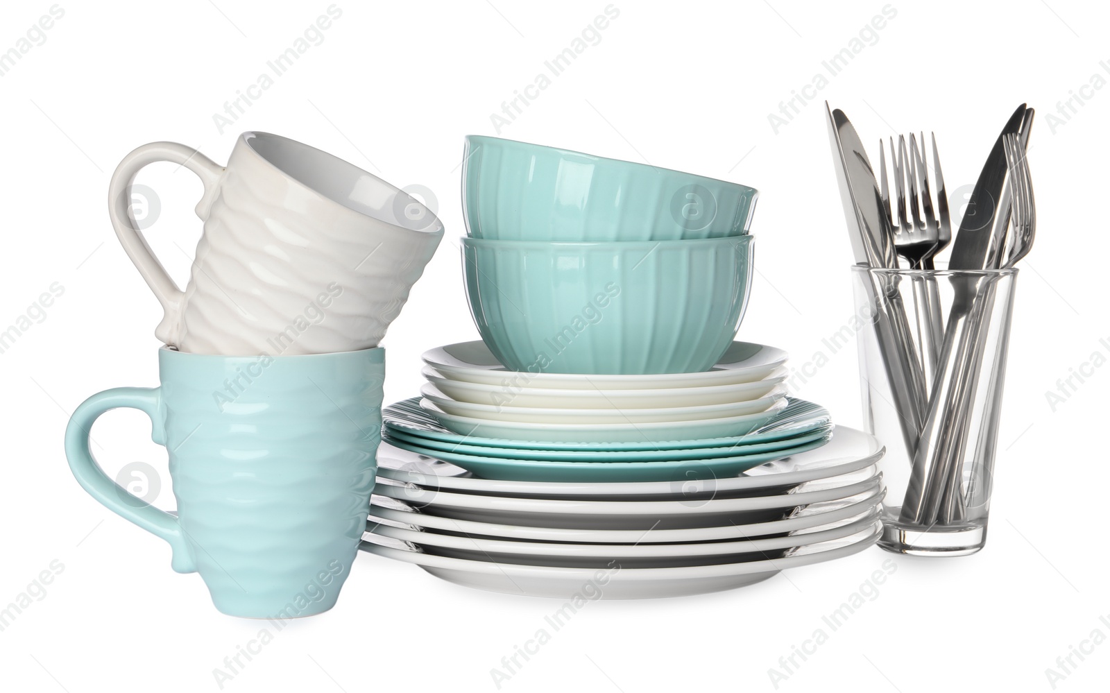 Photo of Set of beautiful ceramic dishware, glass and cutlery isolated on white