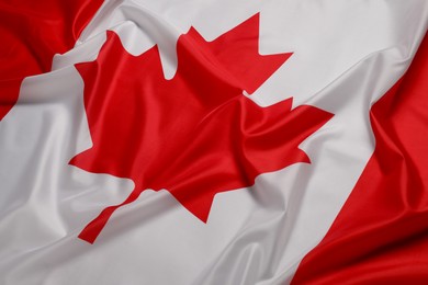 Photo of Flag of Canada as background, closeup. National symbol