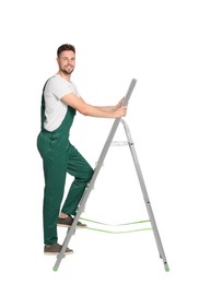 Photo of Worker in uniform climbing up metal ladder on white background