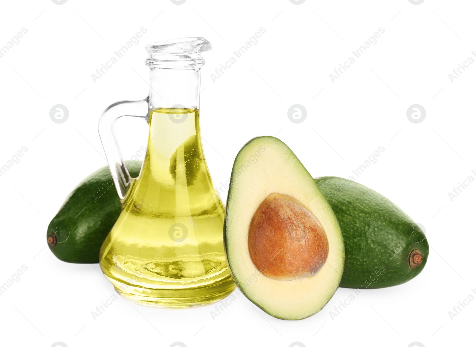 Photo of Cooking oil and fresh avocados isolated on white