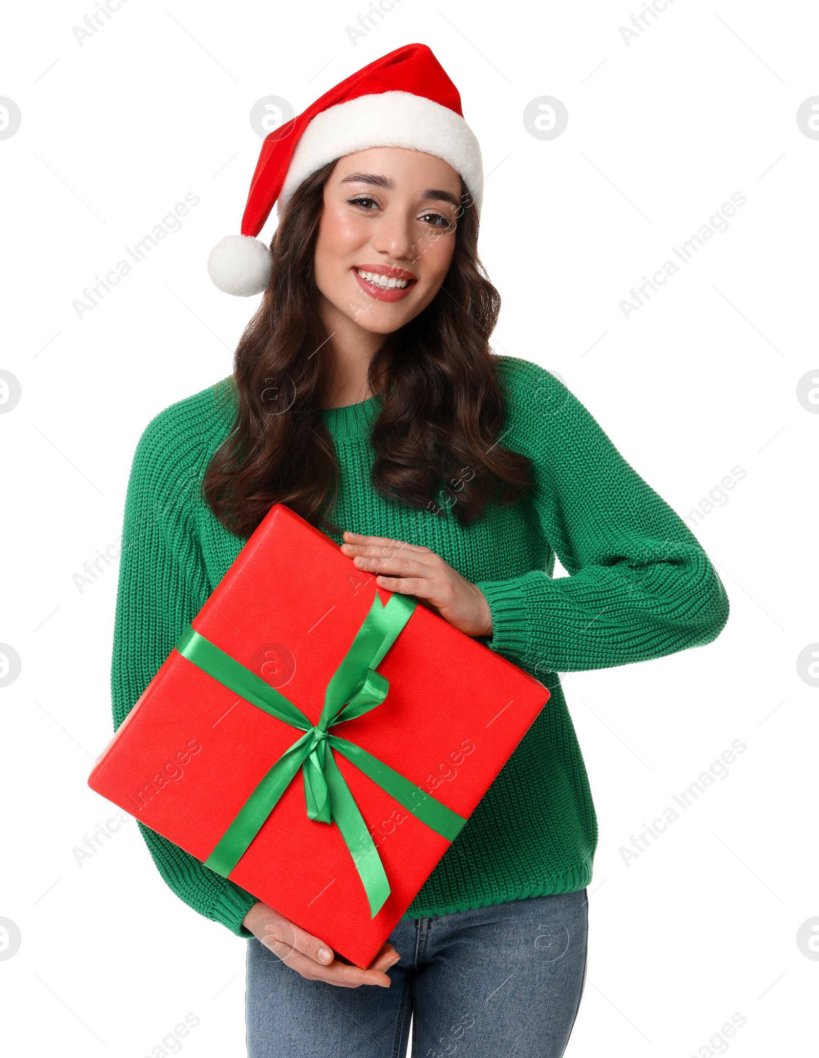 Photo of Beautiful young woman in Santa hat with Christmas celebration gift isolated on white