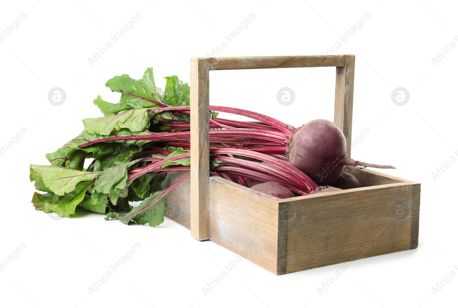 Photo of Raw ripe beets in wooden basket isolated on white