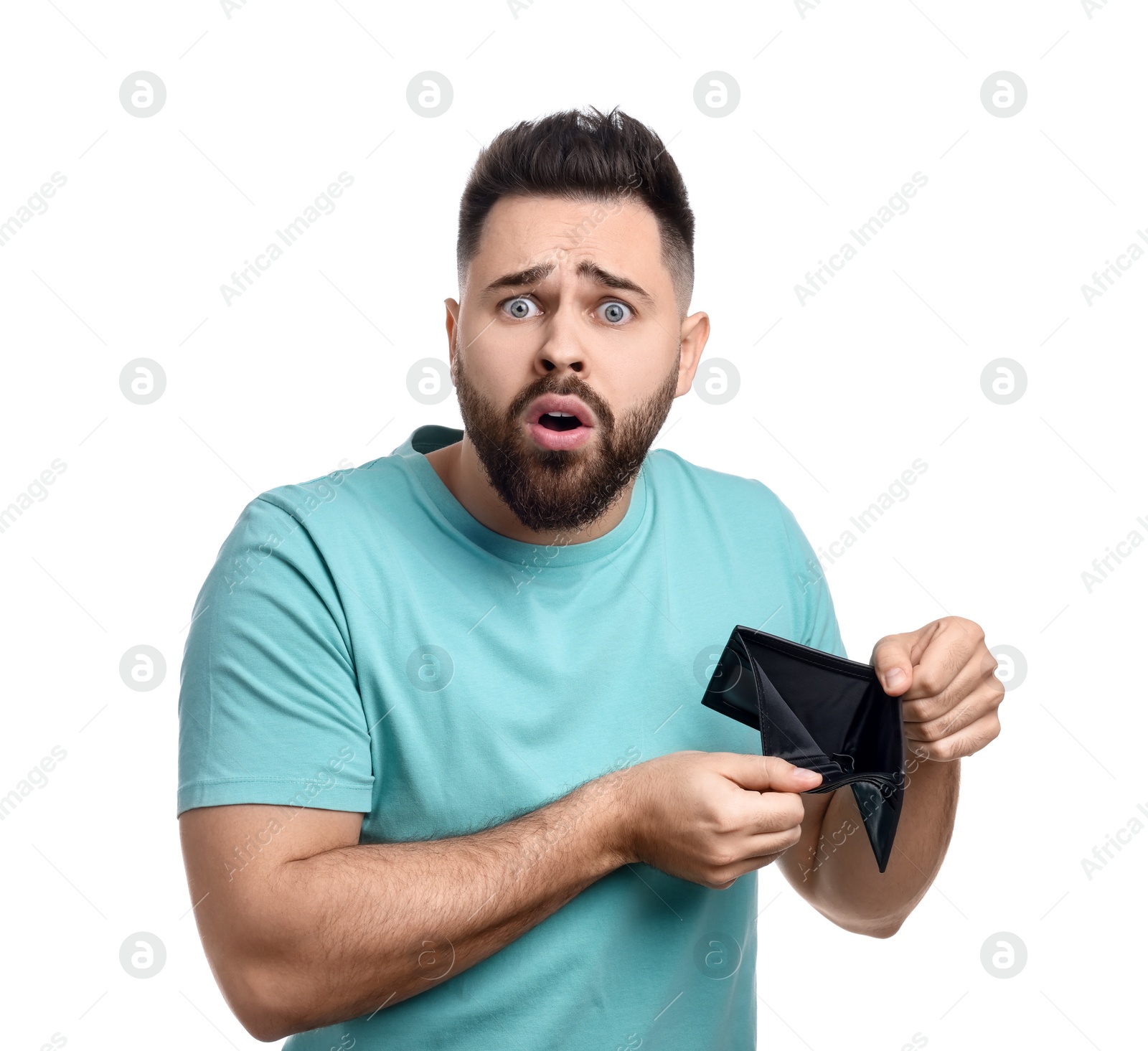 Photo of Confused man showing empty wallet on white background