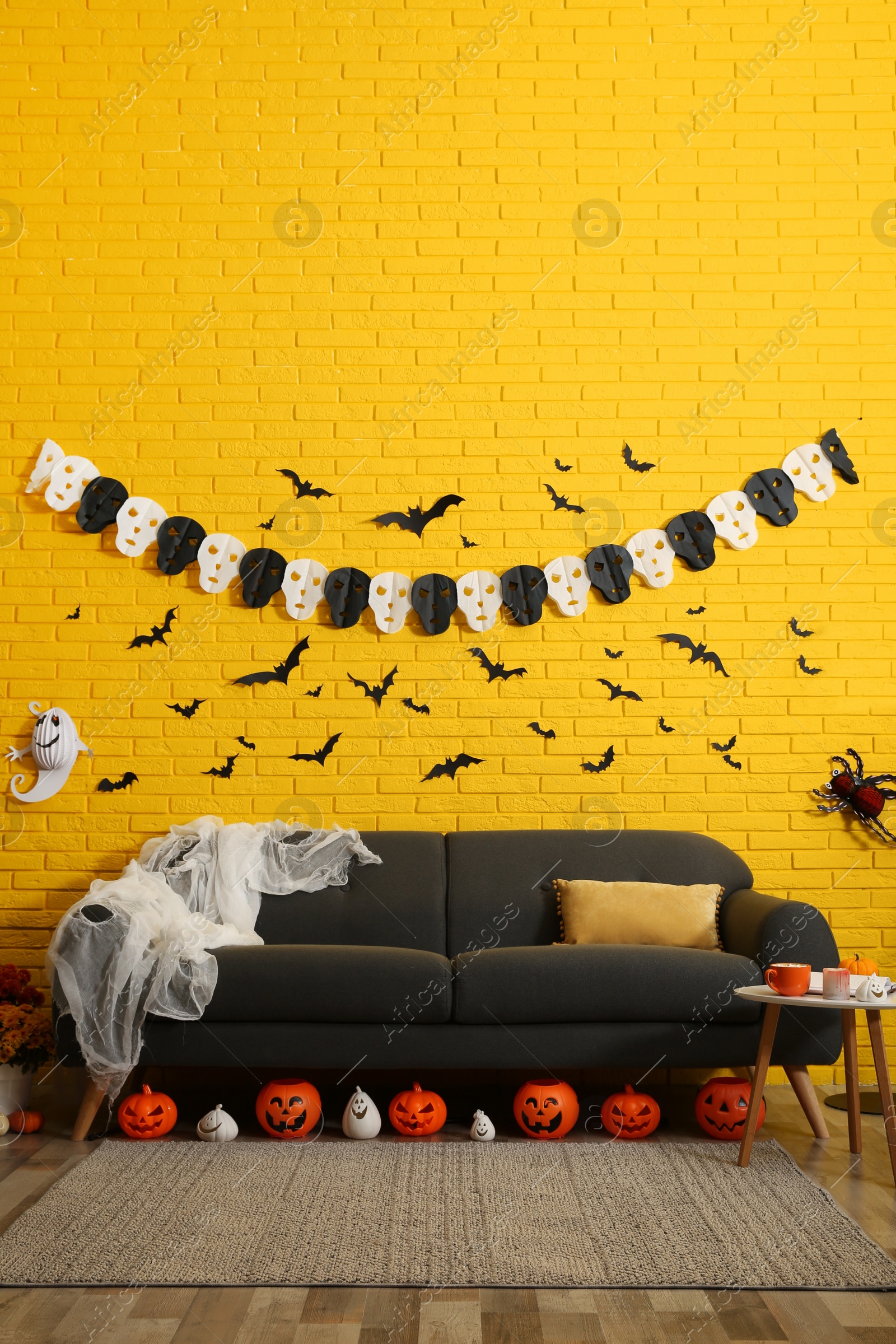 Photo of Modern room decorated for Halloween. Festive interior