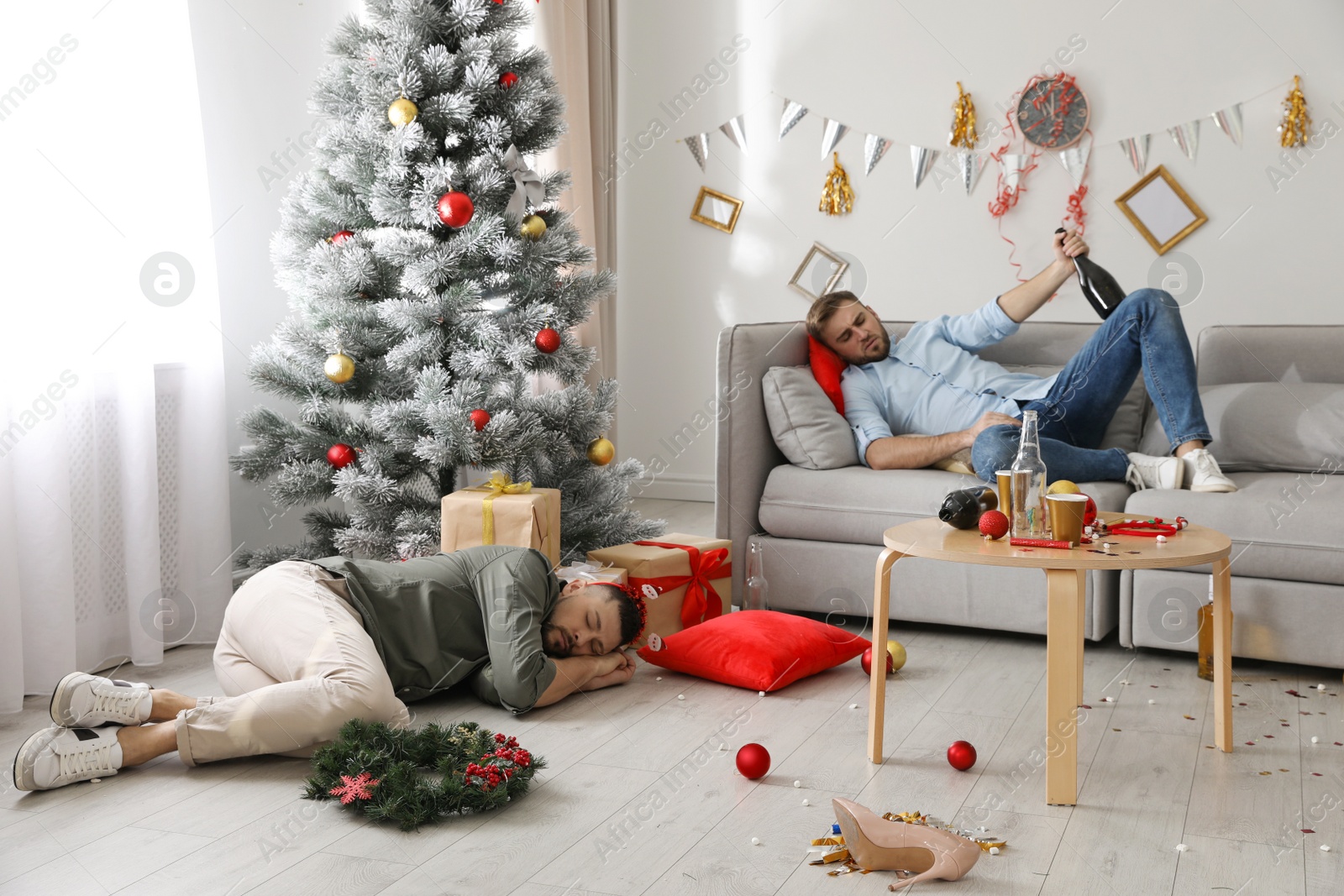 Photo of Drunk men sleeping in messy room after New Year party