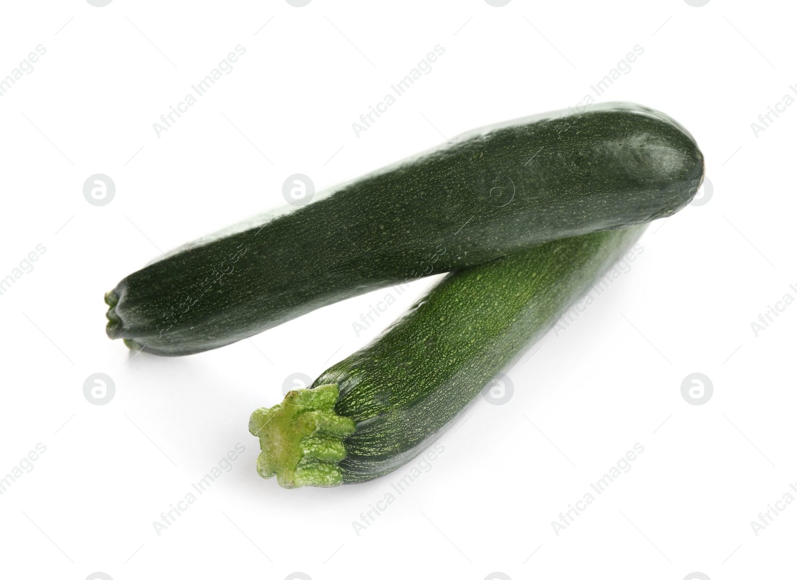 Photo of Fresh ripe green zucchinis isolated on white