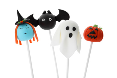 Delicious Halloween themed cake pops on white background