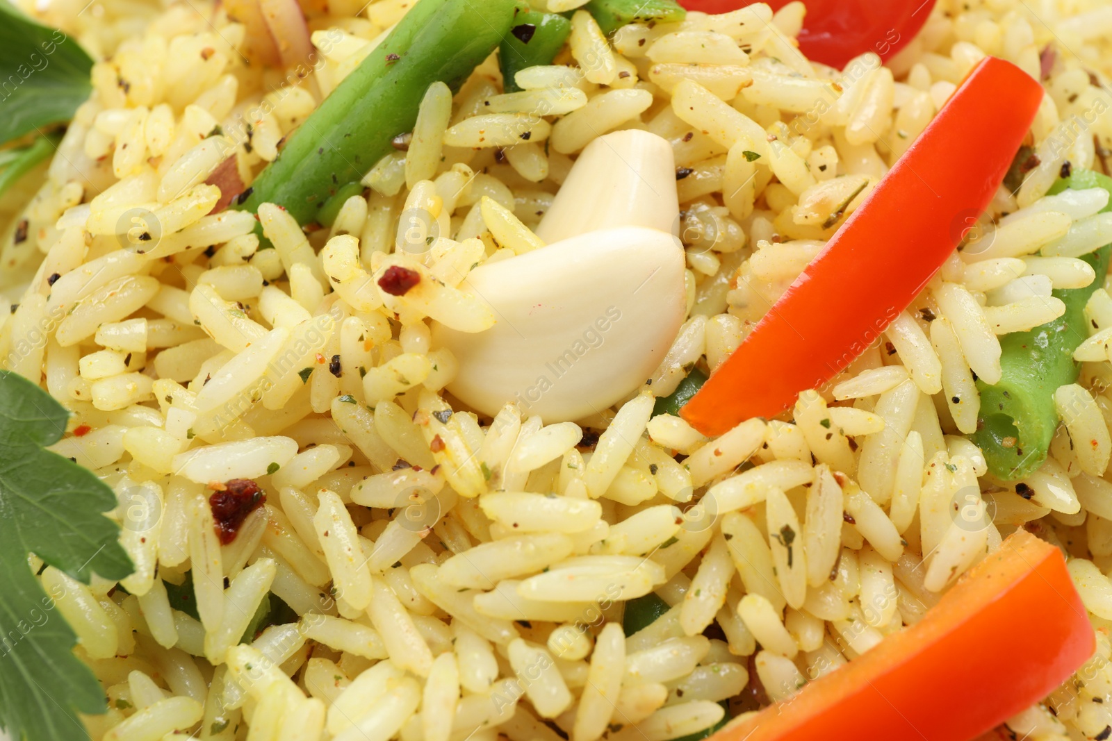 Photo of Tasty rice pilaf with vegetables as background, closeup