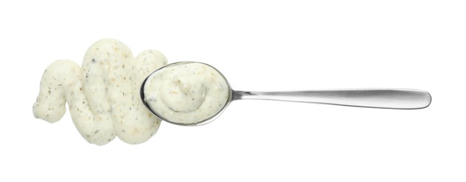 Tasty tartar sauce and spoon isolated on white, top view