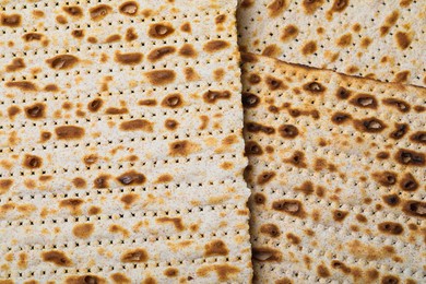 Photo of Traditional matzos as background, top view. Pesach celebration