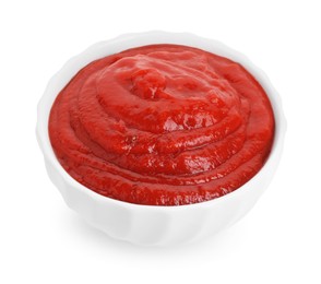 Tasty ketchup in bowl isolated on white. Tomato sauce