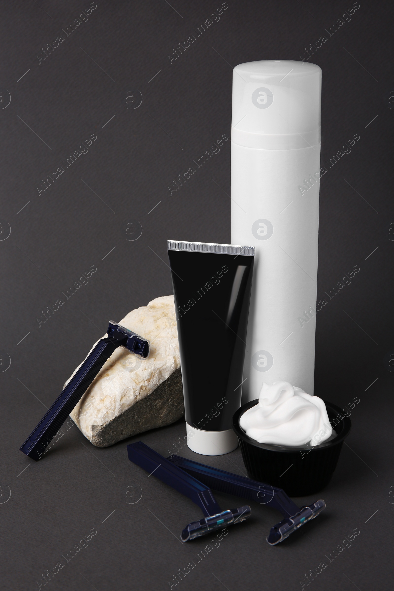 Photo of Different men's shaving accessories on grey background