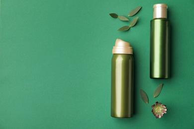 Photo of Flat lay composition with cosmetic products on green background. Space for text