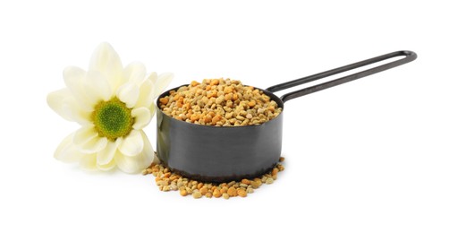 Photo of Fresh bee pollen granules in scoop and flower isolated on white