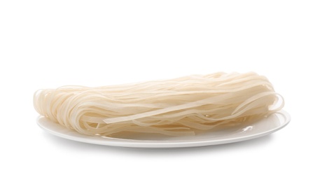 Photo of Plate with raw rice noodles on white background. Delicious pasta