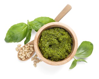 Photo of Fresh tasty pesto sauce and ingredients isolated on white, top view