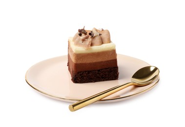 Piece of triple chocolate mousse cake and spoon on white background