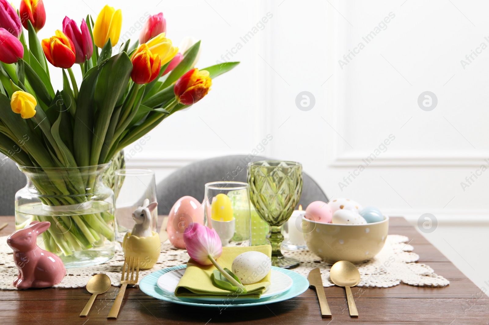 Photo of Festive table setting with beautiful flowers. Easter celebration